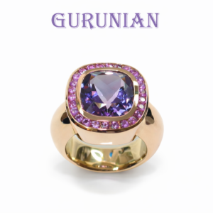 Elegant pink gold ring with amethyst center stone framed with pink sapphires.